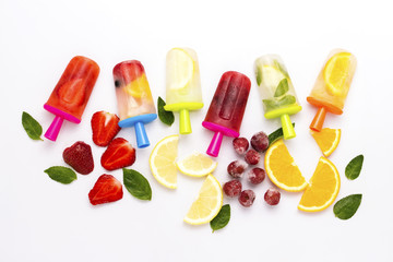 Homemade Multicolored bright fruit popsicle with strawberry, cherry, lemon, orange, lemon and mint...