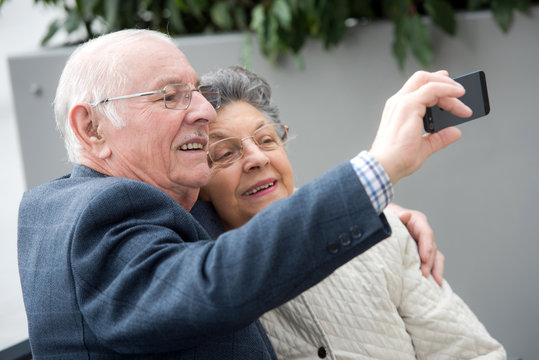 Senior Couple Taking Selfie With Mobile