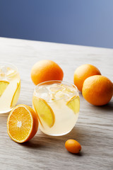 close-up shot of glasses of orange lemonade on wooden surface