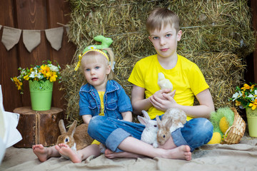 children with chickens and rabbits