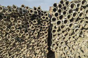 Irrigation metal pipes stacked outdoors out of watering season