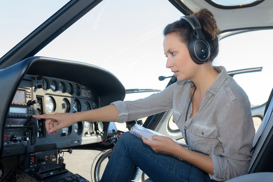 woman pilots flying a helicopter