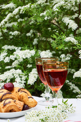 Lunch with red wine and croissants outdoor