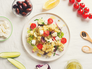 Pasta salad in a plate with ingredients