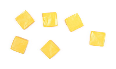 Colorful candies with transparent cellophane wrapping isolated on white background, top view