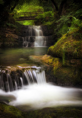 Fototapeta na wymiar The Sychryd Cascades, (Sgydau Sychryd in Welsh) a set of waterfalls near the Dinas Rock, Pontneddfechan, South Wales, UK 