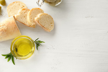 Bread and olive oil on wooden table