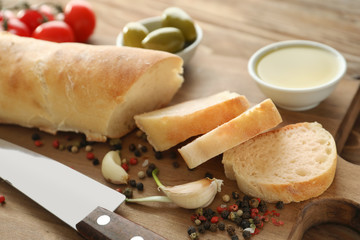Bread and olive oil on wooden table