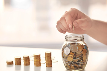 Man counting savings on table