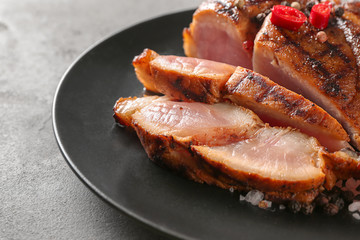 Sliced tasty steak on plate, closeup