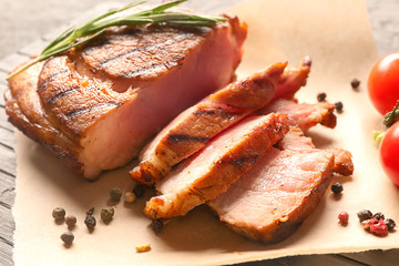 Sliced tasty steak with spices on table