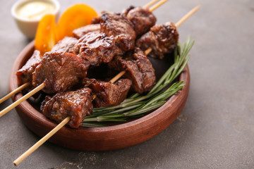 Barbecue skewers with juicy meat on plate