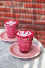 Colorful pink super latte on marble background