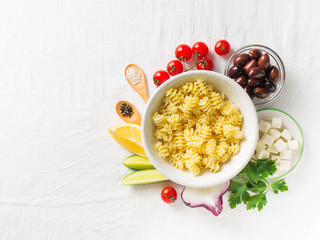 Pasta salad in a plate with ingredients