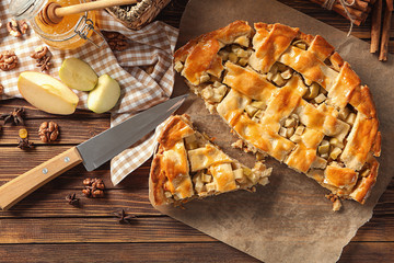 Tasty homemade apple pie on wooden table