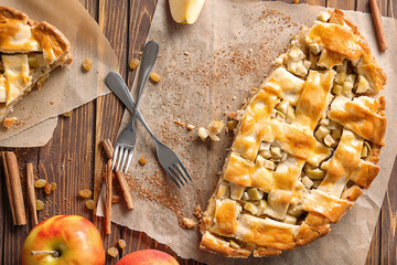 Tasty homemade apple pie on wooden table