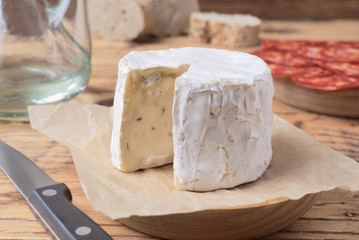 Fototapeta na wymiar cheese and Iberian chorizo on rustic board