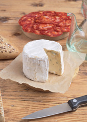 cheese and Iberian chorizo on rustic board