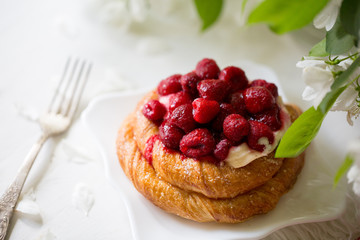 Spring mood. Blooming apple tree. Raspberry pie. Sweet cake with berries.