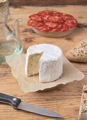 cheese and Iberian chorizo on rustic board