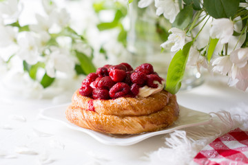Spring mood. Blooming apple tree. Raspberry pie. Sweet cake with berries.