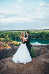 Fototapeta premium Wedding of a beautiful couple against the backdrop of a canyon a