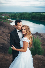 Fototapeta na wymiar Wedding of a beautiful couple against the backdrop of a canyon a