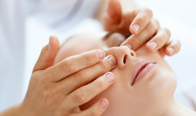 beautiful girl enjoys massage and spa treatments