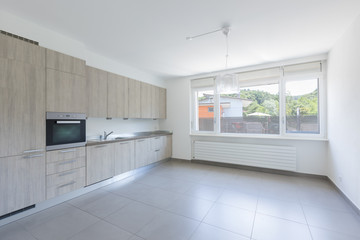 Light wood kitchen with white walls