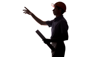 silhouette of male construction engineer with building project in helmet gives instructions on white isolated background