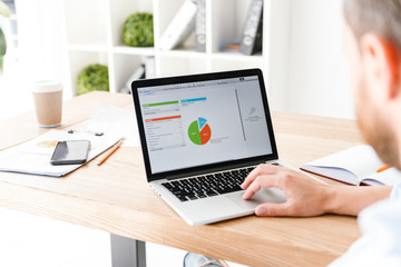 Cropped photo of handsome man in office