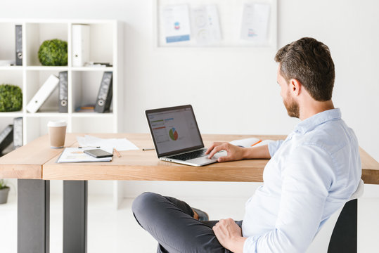 Photo of handsome man in office