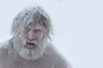 Portrait of a bearded man in the snow
