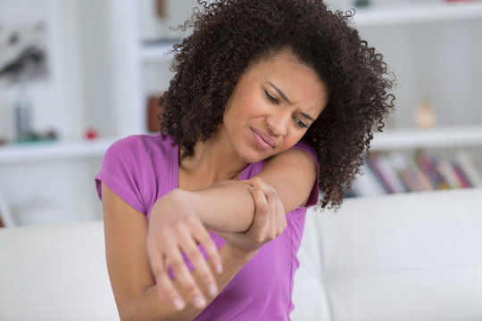 Woman Holding Painful Elbow