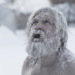 Portrait of a bearded man in the snow