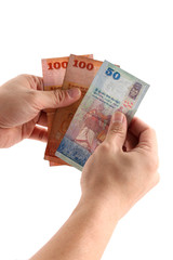 Sri lankan banknotes of 100,50 and 20 rupees in hands isolated on white background counting money 
