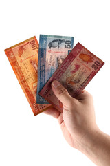 Sri lankan banknotes of 100,50 and 20 rupees in hands isolated on white background counting money 