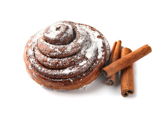 Sweet cinnamon bun on white background