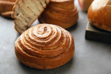 Sweet cinnamon bun on table