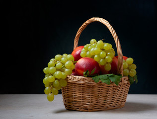 still life of grapes in a basket ripe green red natural holiday