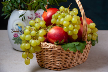 still life of grapes in a basket ripe green red natural holiday