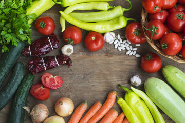 Various fresh vegetables from market on wooden background