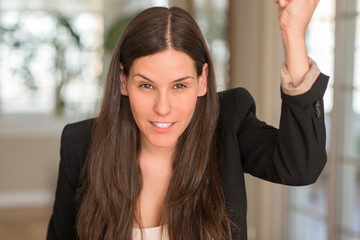 Young beautiful woman at home annoyed and frustrated shouting with anger, crazy and yelling with raised hand, anger concept