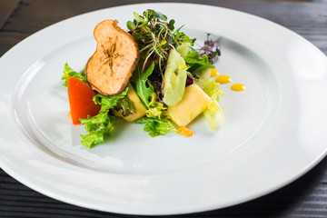 Vegetable salad on wooden background