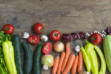 Various fresh vegetables from market on wooden background