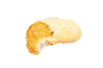 Chicken nugget with cheese sauce isolated on white background