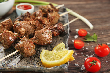 Barbecue skewers with juicy meat on plate