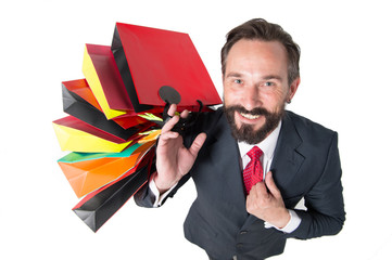 handsome beaded man with lot of shopping bags top view. man in suit happy from shopping time and...