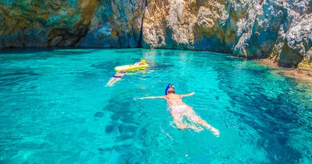 Rolgordijnen Snorkling in the blue lagoon of Palaiokastritsa, Corfu island, Greece © Serenity-H