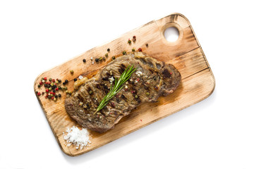 Grilled beef steak isolated on white background. Top view